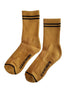 Pair of mustard yellow socks with black stripes and &