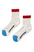 A pair of color block girlfriend socks with gray body and pink detailing on the ankle and toe.